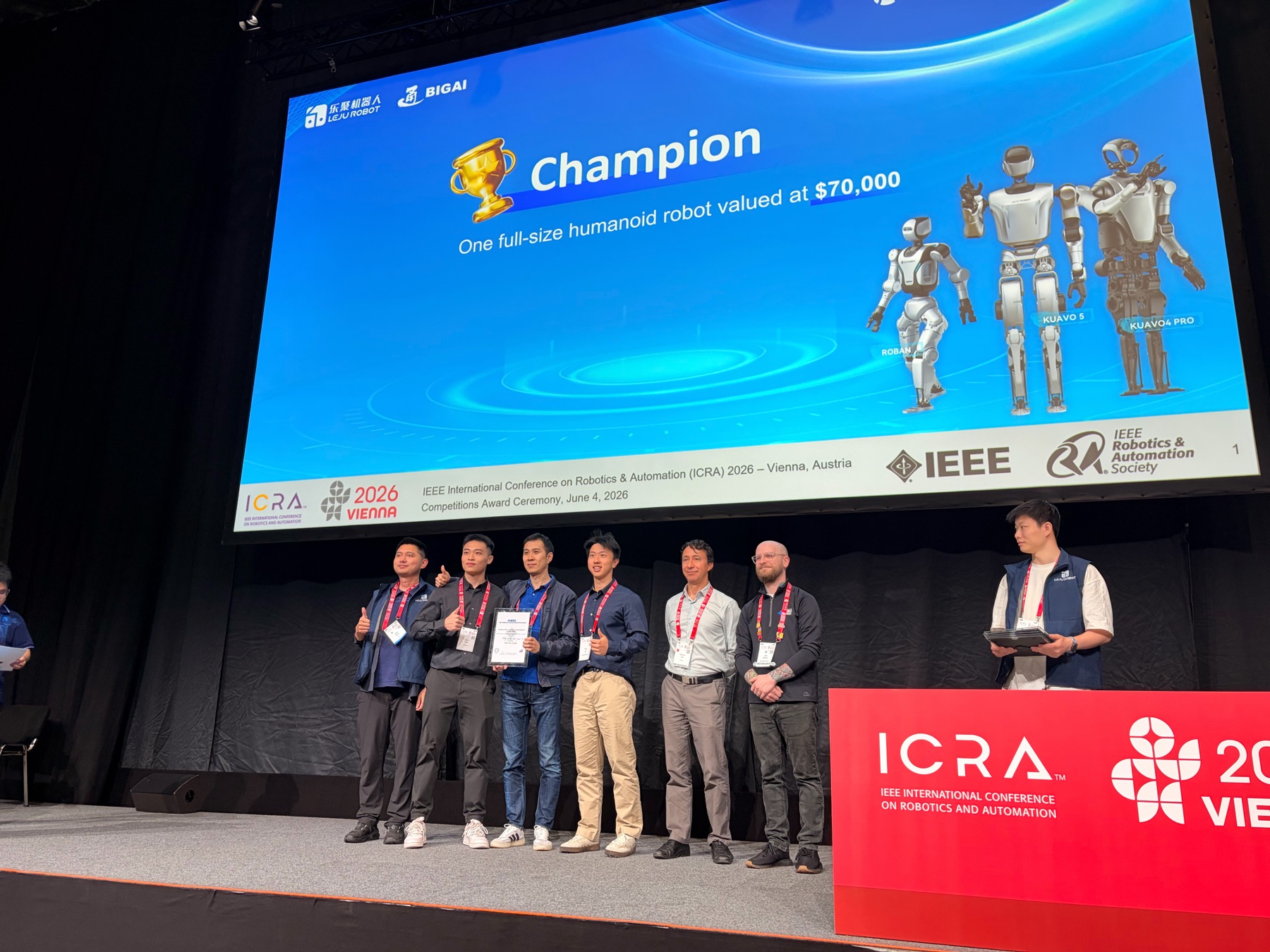 Team NUS-CLEAR on stage at the ICRA 2026 competitions award ceremony in Vienna